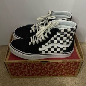 Black and white checkered board high top vans